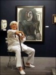 Jan Krugier in 2006, with a painting by Picasso.